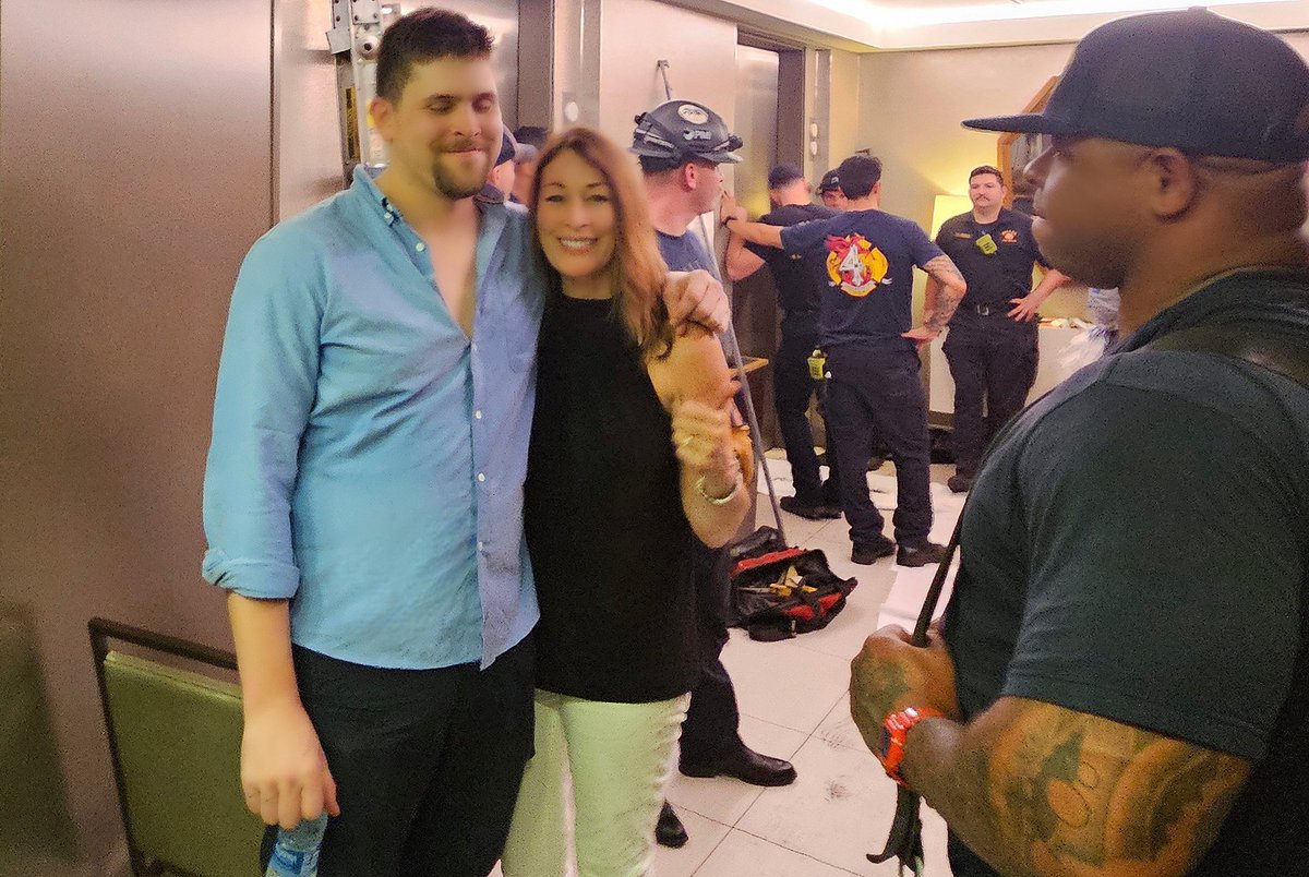 JeriFouts's tweet photo. My son Ryan &amp; I thank the Dallas FD for rescuing 15 of us trapped in a hot elevator for 2 hrs with little air and an uncertain outcome. Justin Herbert &amp; the Charger players &amp; our new friends Shon &amp; Mario handled it with calm and grit, and Dan guiding by phone. Thanks @VERIZON! https://t.co/R9FRj2Snqq