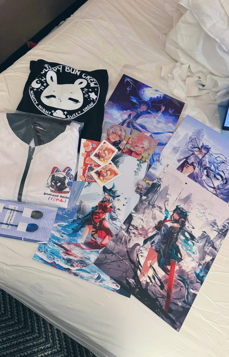My Anime NYC haul!! There's actually more but these are all the artists I bought from

Black sweater: <a href="/S2HEARTbunny/">bunny @ YOUMACON C1</a> 
White jacket: <a href="/Bandage_Brigade/">Bandage Brigade</a> 
Drink spoons: <a href="/Curoie/">Curoie</a> 
FFXIV prints: <a href="/krawark/">Renos ▶︎⚡Fanime 908⚡</a> 
Honkai star rail postcards: <a href="/allenerie/">Allenerie || ✦</a> 
Arknight prints: <a href="/grape______/">grape 🍇</a>