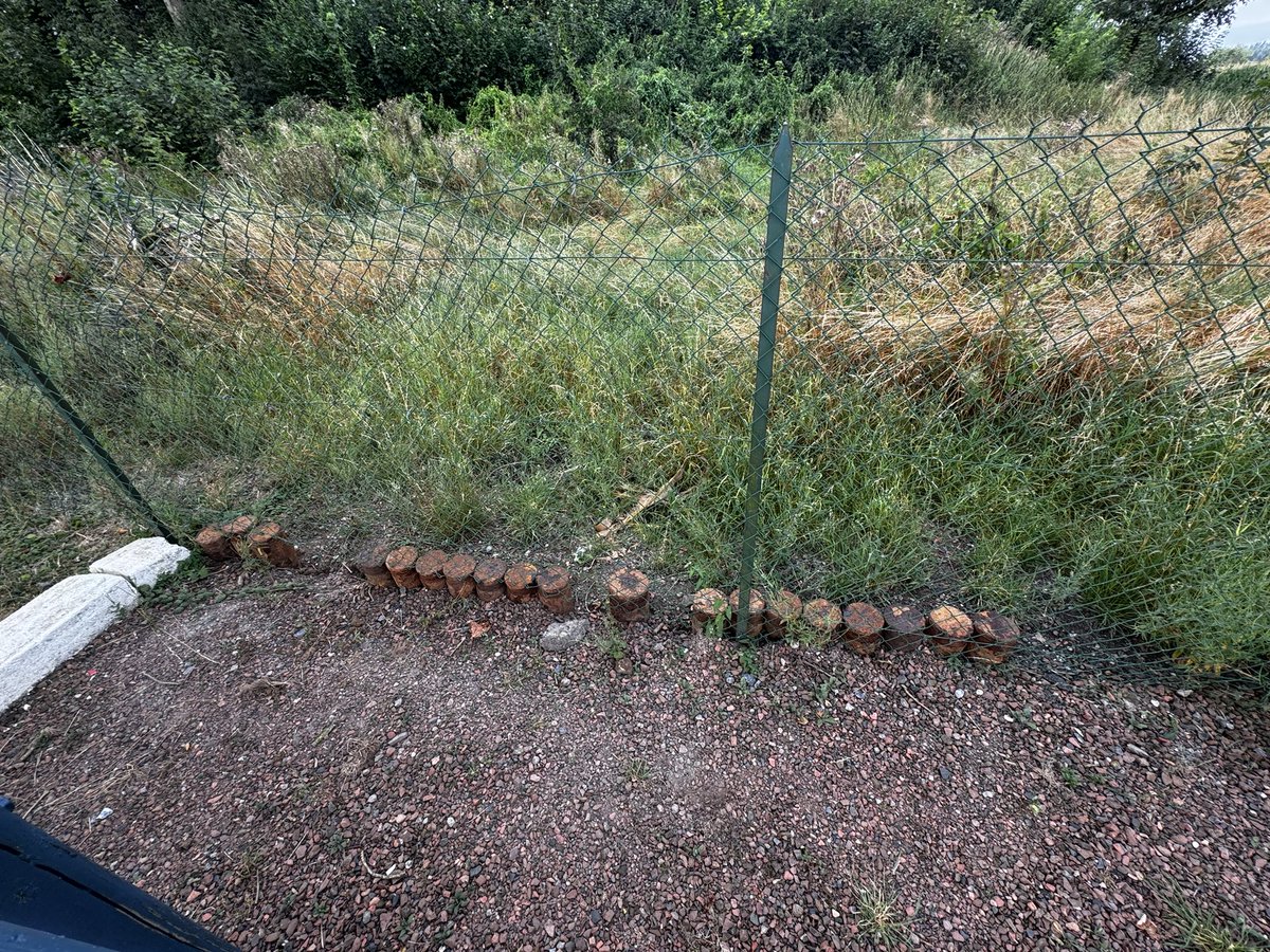 ButteDeWar's tweet photo. You will see that there are a number of old shells that have been fixed into the ground around the fence. These are not for people to take away or help themselves like someone has here!  They are there to stop animals entering the site and destroying the archaeology. https://t.co/r0XG0cygC3