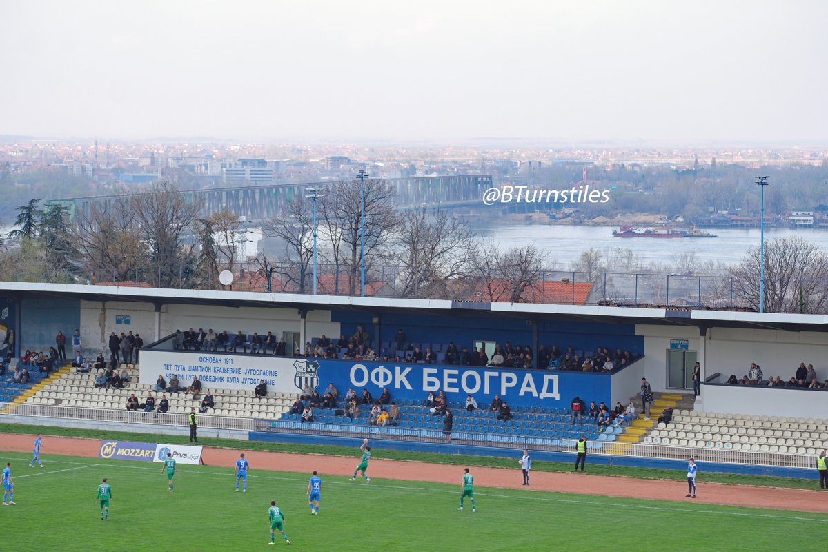BTurnstiles's tweet photo. A return to Belgrade's 1957 Omladinski Stadion today,  overlooked by the fabulous Karaburma residential tower which locals call the 'Toblerone' building. @OFKBeograd  are back in the Superliga this season and have rebranded as themselves with the unwieldy moniker OFK Beograd Mozzart Bet. Last season, strict restrictions on cameras inside the now one-sided stadium meant getting creative in the surrounding streets including giving Noah a bunk-up over a fence or two. @SerbianFooty @GroundhopSerbia @FK_Beograd @PeterRMiles @LowerBlock @TerraceEdition @theterracelife @Zeitspielmag @Staantribune @WSC_magazine @Mike_Bayly @Andrew007Uk @JustinWalley10 @fodboldword @thesefootytimes @FSSrbije
