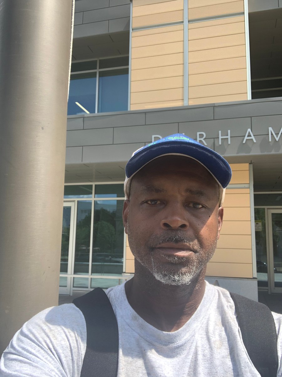DurhamCounty's tweet photo. Kelvin and Phillip with General Services took a moment out from helping keep our buildings looking awesome on this hot afternoon to snap a couple pics for #CityHallSelfie day w/ the Admin II Building in the background. Hugs props for all the work GS does! #DCoRocks @ELGL50 https://t.co/RtVrkp1zJ9