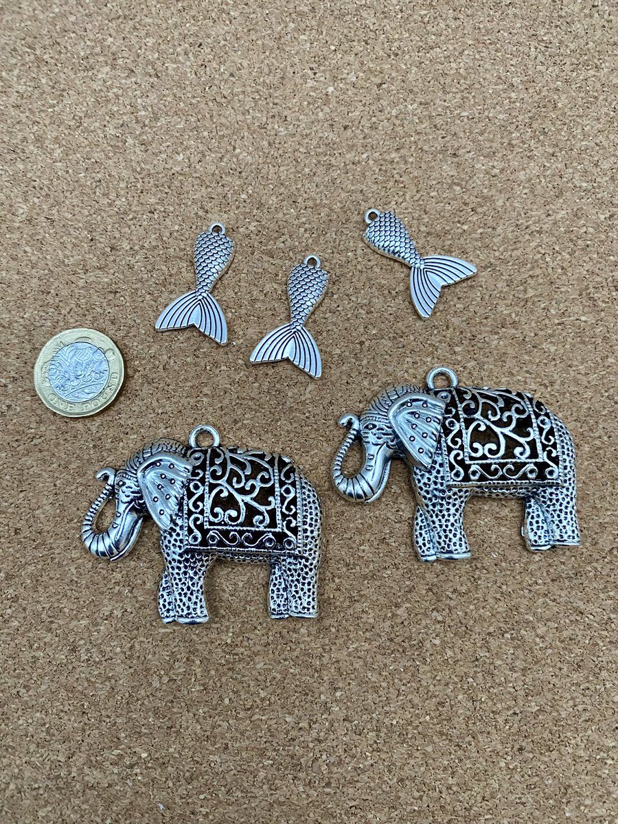 DanglesJeweller's tweet photo. A couple of new charms just arrived.  Elephant bag charms have been popular previously….   Mermaid tails may appeal as key rings / small bag charms for swimmers, wild or otherwise. #mhhsbd #charms #handcrafted #crafbizparty https://t.co/02lxmSSifL