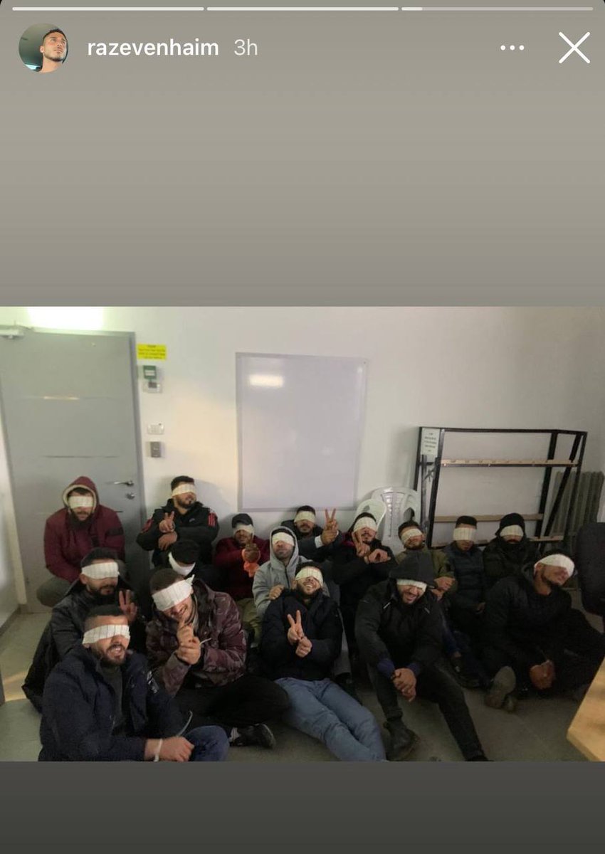 QudsNen's tweet photo. An Israeli soldier forced blindfolded and handcuffed Palestinian detainees to smile for the camera at gunpoint and posted the photos on his social media account. https://t.co/D70CuzqcCw