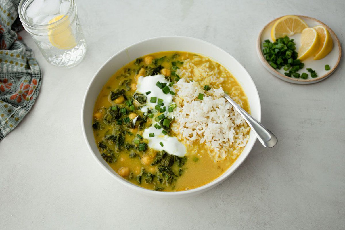 Curried Coconut Chickpea Stew with Greens | This soup comes together fast and is packed with hearty, plant-based ingredients. It's very accommodating, so feel free to add extra fresh or frozen vegetables if you'd like. |  buff.ly/3Ss8eCc #nowcooking