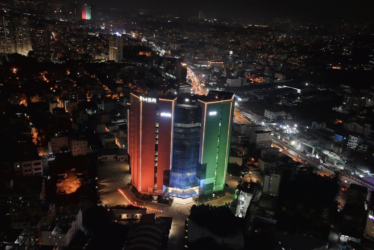 RakshaRamaiah's tweet photo. On the occasion of the 78th Indian Independence Day, the MSR North Tower proudly shines in saffron, white, and green! 

Let’s honor our nation's spirit by turning patriotism into action, leading with infrastructural development to ensure progress reaches every corner of India. 

Jai Hind! 🇮🇳 

#IndependenceDay #India78 #Msr #MSRamaiah #Bengaluru #India❤️ 

https://t.co/NKnBZDtvOX