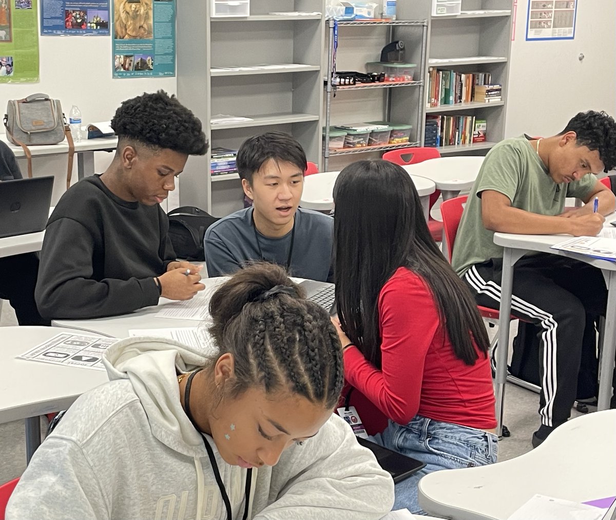 BellaireHigh's tweet photo. Student Leadership! A senior TA leans in to help students and push their thinking today in Ms. Kuhleman’s AP World History. It’s great to see examples of leadership inside and outside the classroom! #BHSLearn https://t.co/aL8clLxuPC