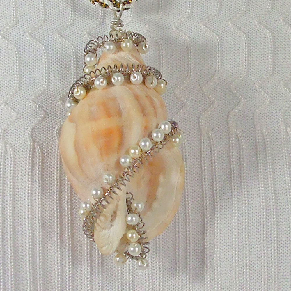 SandeeJene's tweet image. JBSG.  HandCrafted.  Conch Shell wrapped with Pearl beads, hanging from kumihimo braided gold &amp;amp; white cord.  17 inch around the neck at collar bone.   Buy New: bit.ly/Shp-Wht-New   #JBSG   #WhatNew    #Handmade   #HandCrafted    #Necklace     #Pendant    #ConchShell