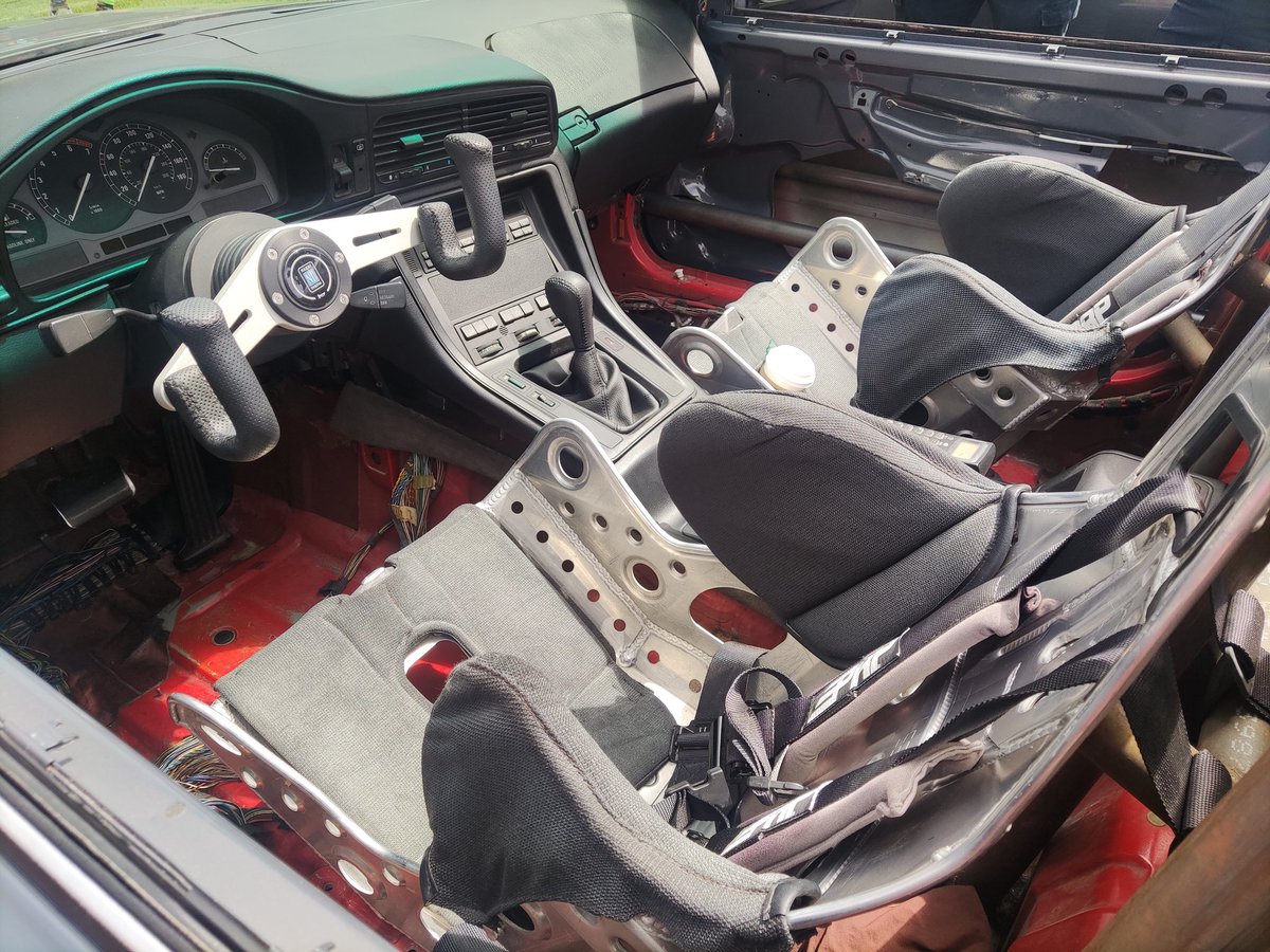 GregKable's tweet photo. Outstanding! Wrecked and written off BMW 8er brought back to life as a stripped out roadster ... with rear domes, a roll cage for structural rigidity and a Nardi yoke steering wheel because, well, why not?

#Legendsoftheautobahn https://t.co/4QuEz2rHMk