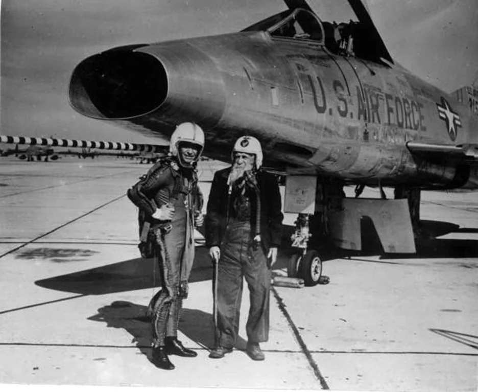 This is a U.S. Civil War veteran posing in front of a fighter jet in 1955