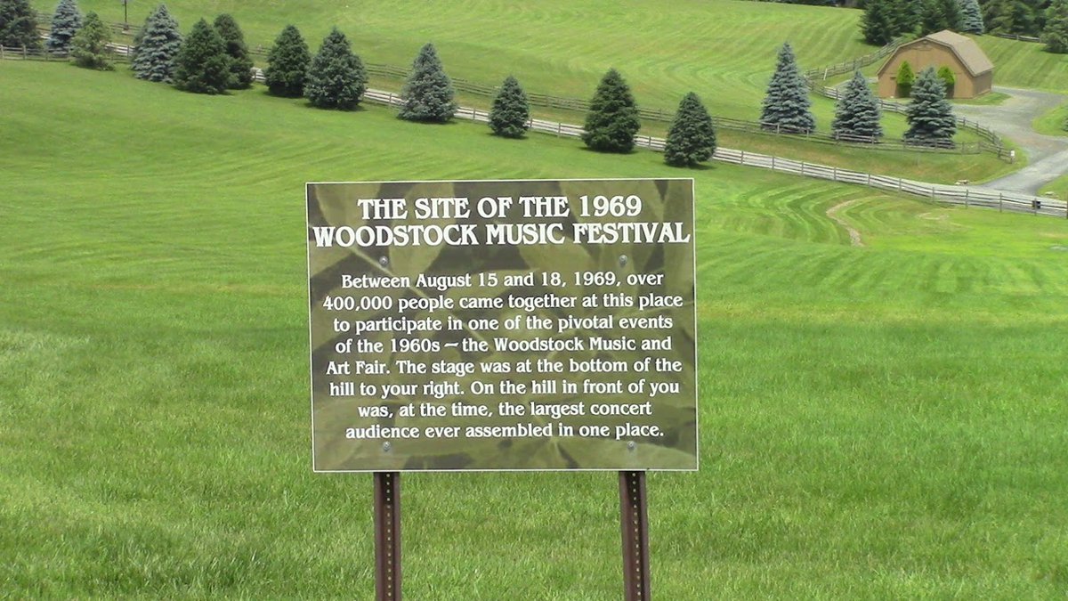 Woodstock 1969:  the stage area is still visible if you visit the site. It was located right over the top of the sign where the pine trees are.