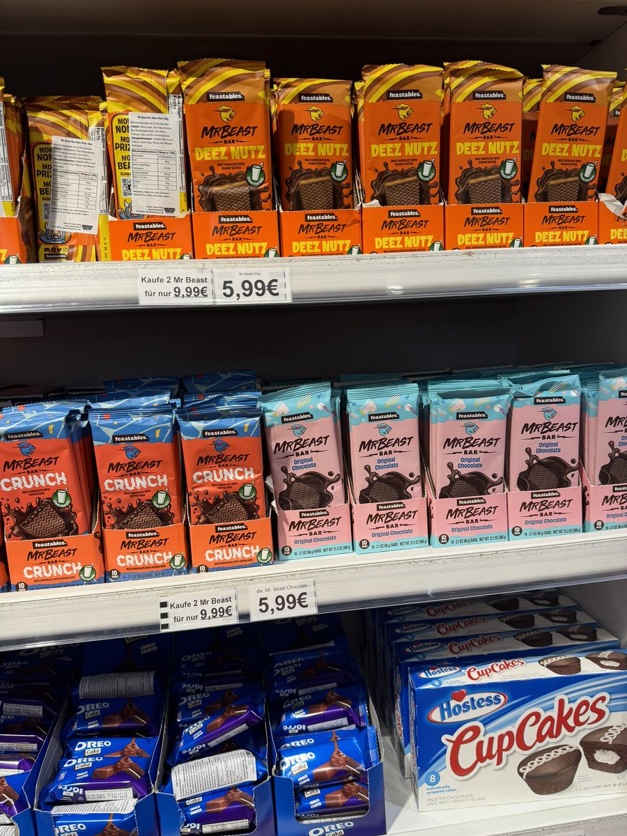 ZackP20's tweet photo. @MrBeast A shopping mall in Vienna sells feastables but 5,99€? Also it’s next to herseys… blasphemy! https://t.co/5PCkOKcE53