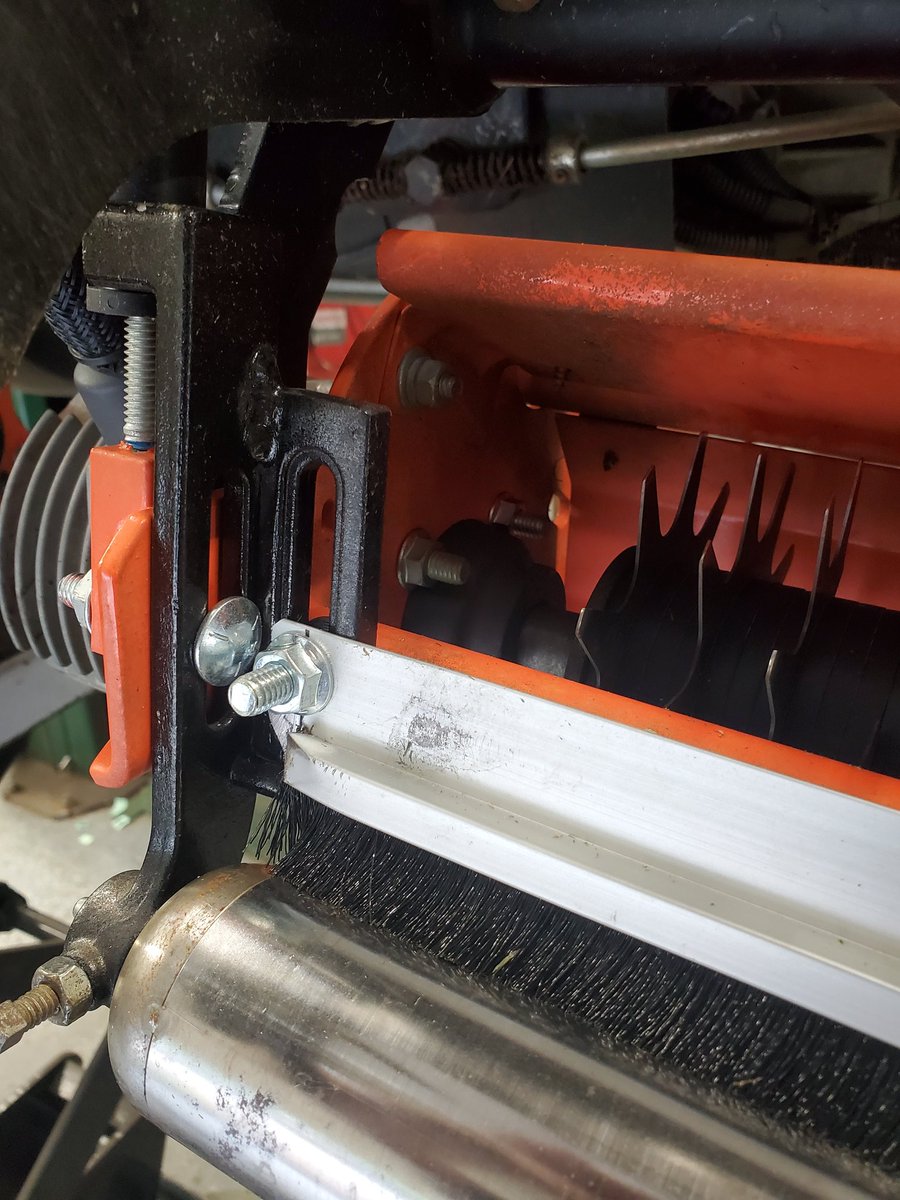Adjustable roller brush contraption I came up with. Works slick! When you have to get creative to get what you need you figure it out.. we kept getting large amounts of grass build up on the rollers while verticutting.
