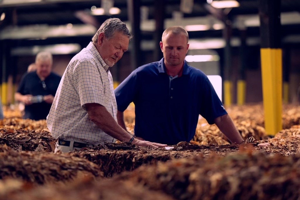 CoastalAgro's tweet photo. Wallace Tilghman ("Gator") and Rob Beasley, with Coastal AgroBusiness,  attended the 135th Grand Opening of the Wilson Tobacco Market.  Coastal AgroBusiness is proud of its tobacco heritage and  supports growers throughout the region. https://t.co/wpJLIwJCco