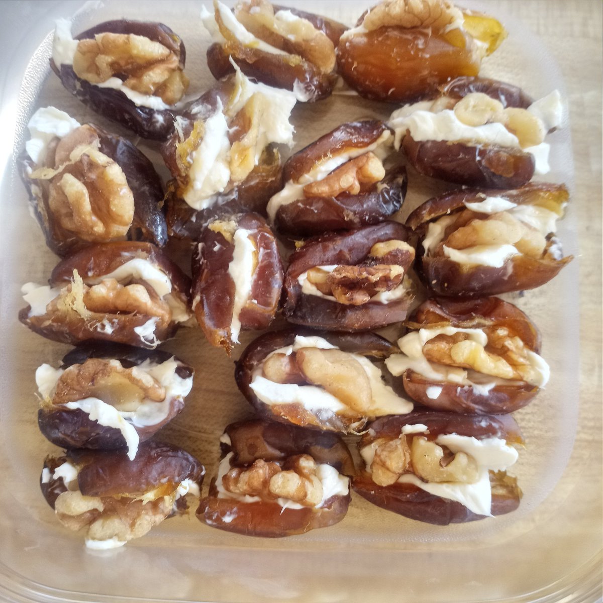 flick out the seed with your knife, then add a dob of cream cheese inside the date, smash a walnut down into the cream cheese. Enjoy your walnut cheese cake bite.