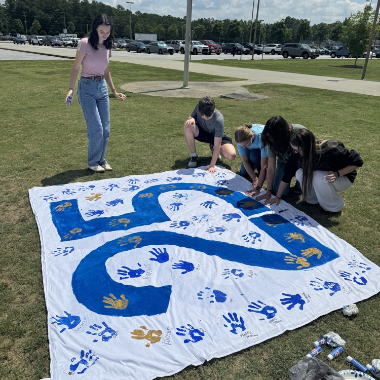 DWDanielHigh's tweet photo. Grounds crew giving DWD a fresh cut, orientation in the library learning commons, and class of 25 leaving their legacy with handprints on senior flag. #day010 #oneDANIEL https://t.co/jw3CpjDmLu