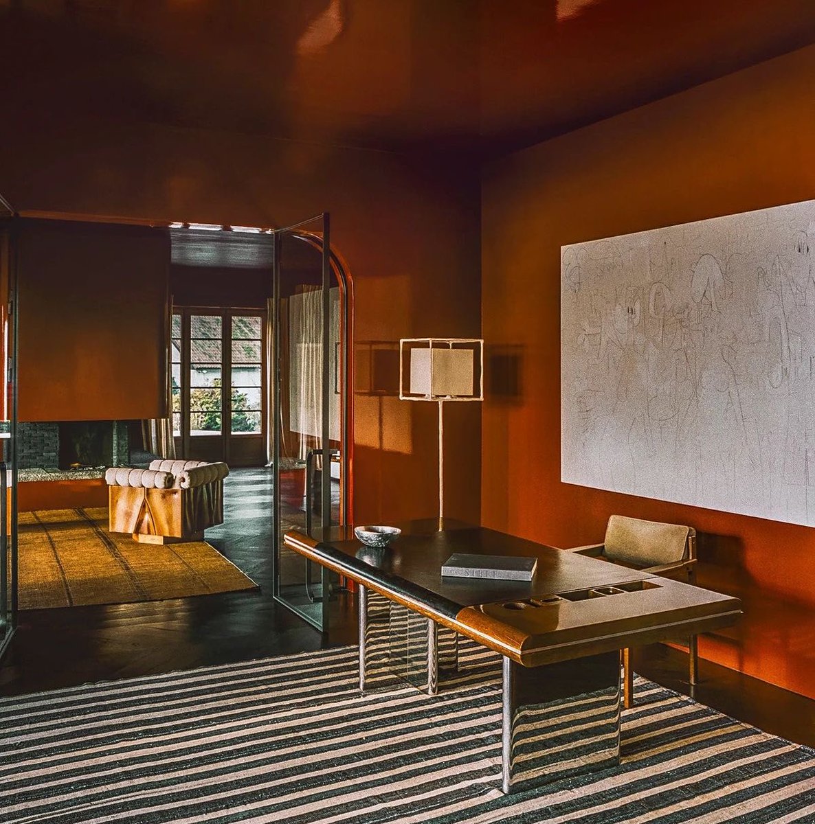 Deep warm tones and moody lighting are an unmatched interior design combo