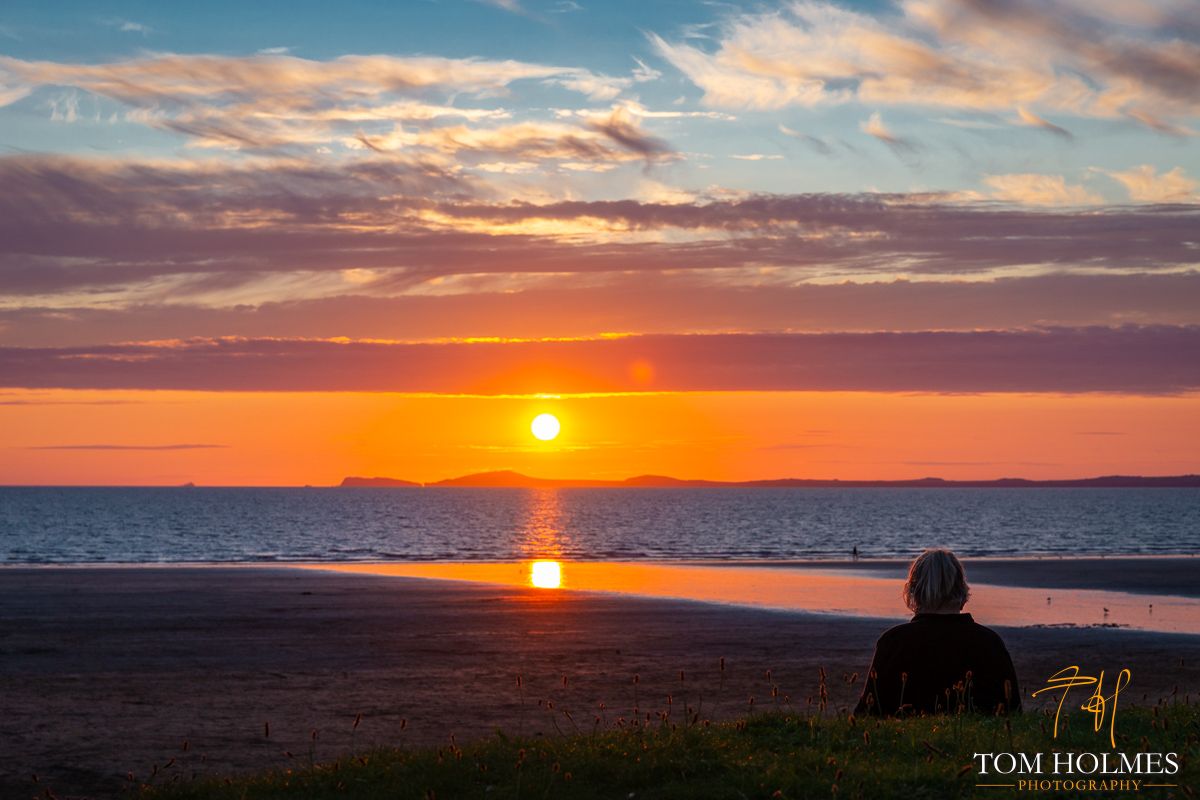 "Broad Haven Sunset"
A breathtaking view of the sunset over the beach at Broad Haven in Wales captures the beauty and tranquility of nature. The golden hues reflecting on the calm waters create a serene and mesmerizing scene that invites peaceful contemplation. 

© Tom Holmes