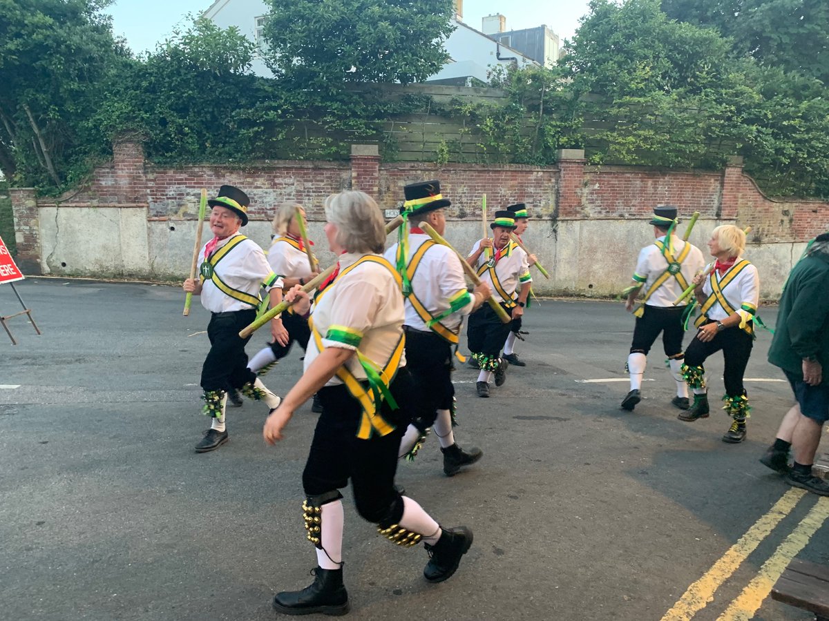 Shingle_beach's tweet photo. Long Man Morris dancing outside The Pilot this evening. Any time I see a Morris side I think of Sir PTerry. #longmanmorris #meads # eastbourne https://t.co/HIbfFMkr1j