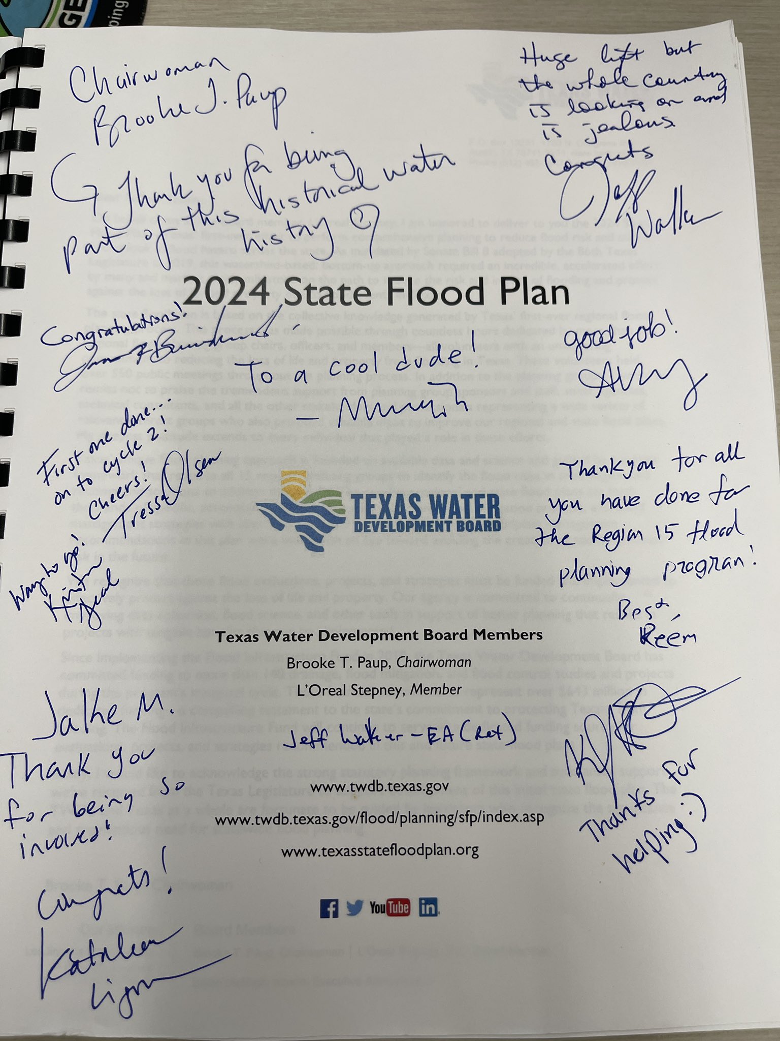 Texas Water Development Board 2024 State Flood Plan book with signatures of all board members and region 15 members