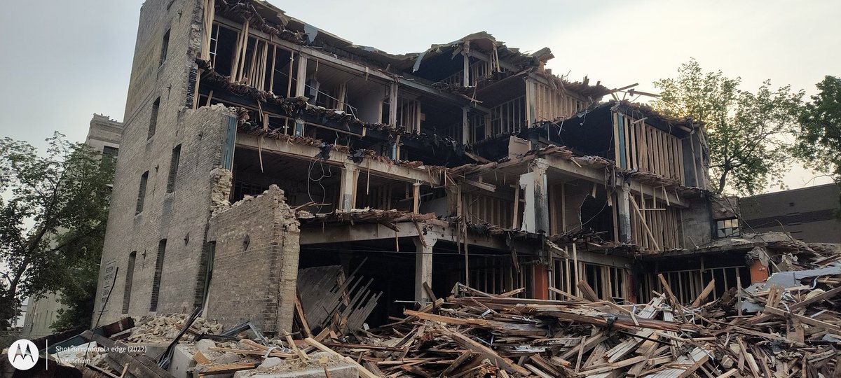 Lots of insulation laying in the back lot of 579 McDermot.