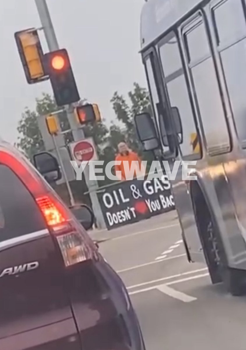 yegwave's tweet photo. Man spotted with a “Oil &amp; Gas Doesn’t ❤️ You Back” sign at an intersection in Edmonton. https://t.co/AGnZzB5qyP