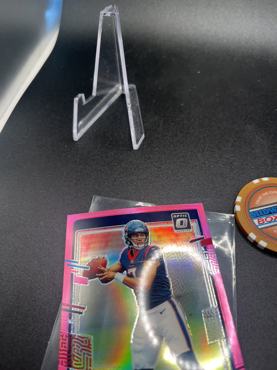 LilJoker221's tweet photo. Selling our new CJ Stroud pink prizm we opened last night. Including the base Anthony Richardson Optic too. The Stroud has a print line through his shoulder pads. See picture

$70 shipped for both https://t.co/vFkp4kxJ60