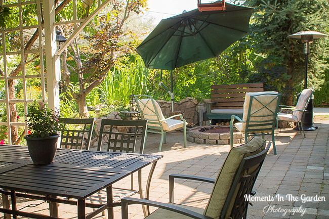 MomentsintheG's tweet image. My patio area.  Making the most of the Summer days.  #patio #augustgarden #seatingarea #outdoorfurniture #winebarrel #handingbasket #containers #shadyarea #firepit #momentsinthegardenphotography