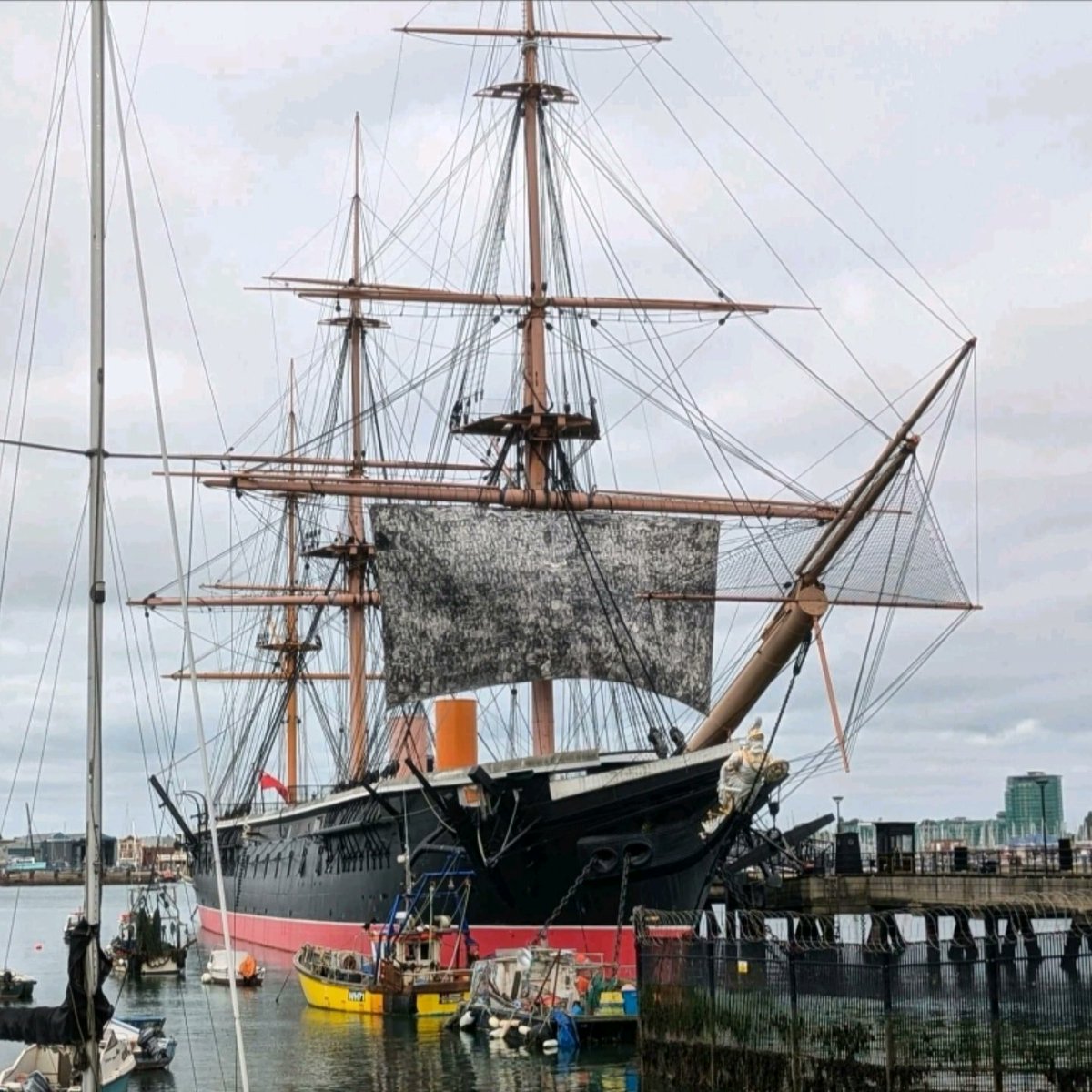 CROWD drawing rigged to HMS Warrior in Portsmouth Harbour. This epic charcoal drawing took 3yrs and is 17m x 10m on a real canvas sail. This portrait of the city has 1000 characters illustrating 2 millenia of local and national history.  Follow in Instagram for more info