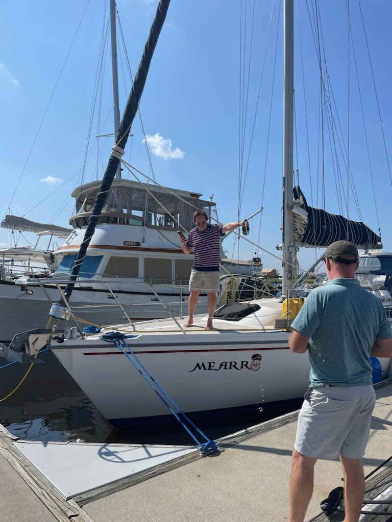 DirdenT's tweet photo. So this happened yesterday. Boat renaming ceremony. Meet S/V Mearr! Meow + pirate "Arr!". I can't wait to say that over the radio. https://t.co/4obRTr9YmD