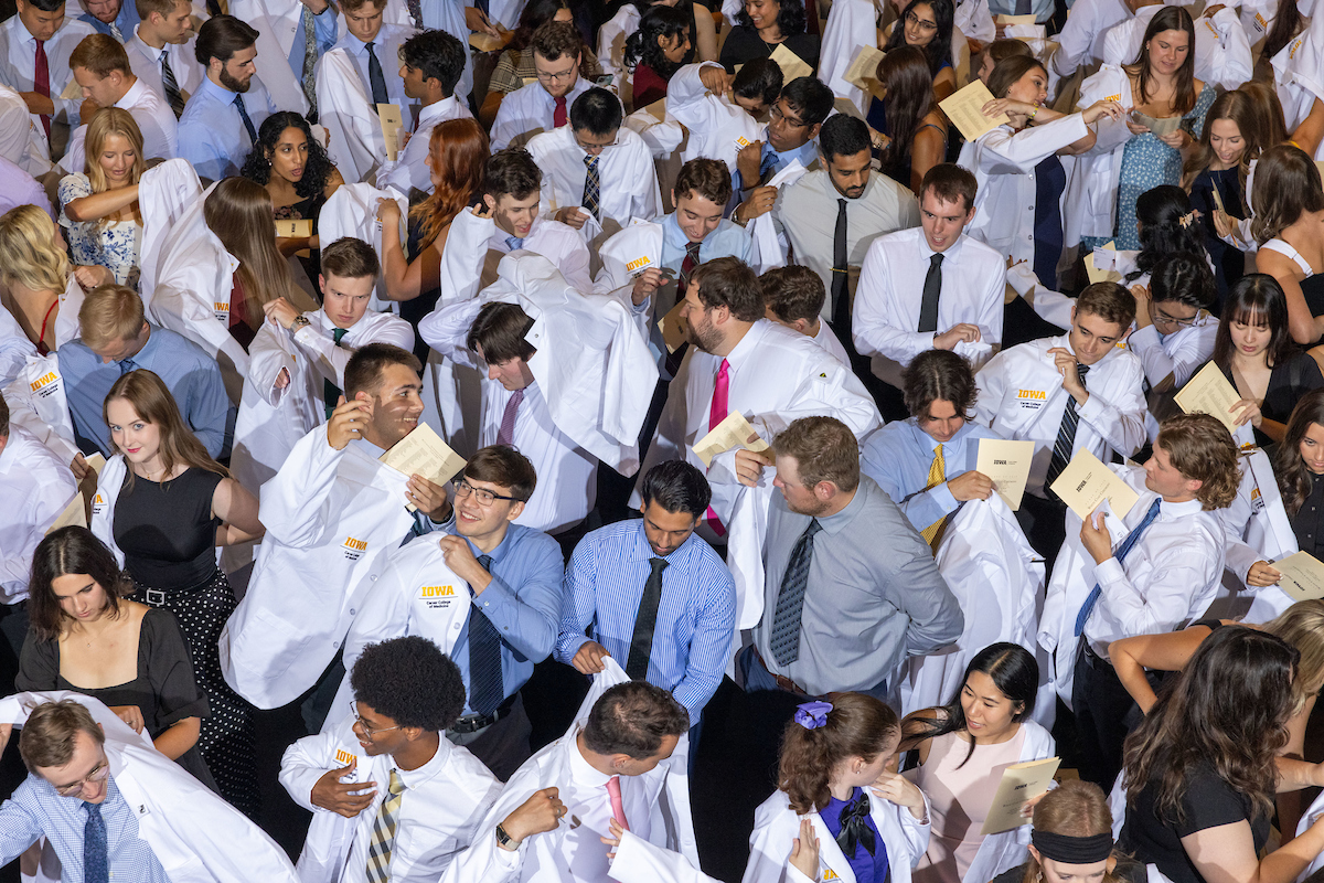 IowaMed's tweet photo. White coats, big smiles, bright futures. 🩺💛 Welcome and congrats to the 153 medical students who officially began their journey at our college yesterday. Let’s hear it for these future doctors! 🎉 https://t.co/QHDavEiZt6
