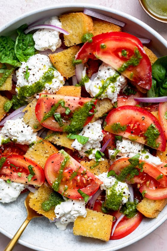 summer_food's tweet photo. Panzanella Burrata Salad drizzled with vibrant pesto vinaigrette: A fresh, flavorful medley of ripe tomatoes, crisp bread, and creamy burrata, perfect for summer dining! https://t.co/LvRYh8uHAb
