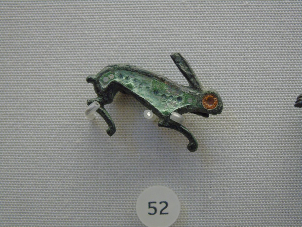 A #Roman brooch in the shape of a rabbit or hare, with faint traces of what would originally have been bright enamel decoration. Animal brooches were popular across the Roman Empire, &amp; this is a very cute surviving example! #Archaeology #RomanArchaeology