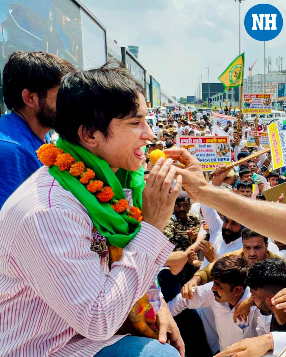 NH_India's tweet photo. A visibly exhausted #VineshPhogat appeared to fall asleep or suffer a temporary blackout on stage at her village of #Balali where she was being felicitated after her return from the #ParisOlympics. https://t.co/xJFL7ArJ6A
