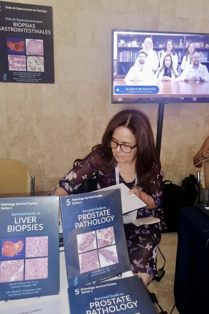 LizMontgomeryMD's tweet photo. Our colleague, Dr. Monica Garcia-Buitrago, is at The 44th Meeting of  The Colombian Association of Pathology signing her new book. It is offered in both English and Spanish at https://t.co/tm0e2UHZPZ #umiamipath https://t.co/kmRJlskrsi