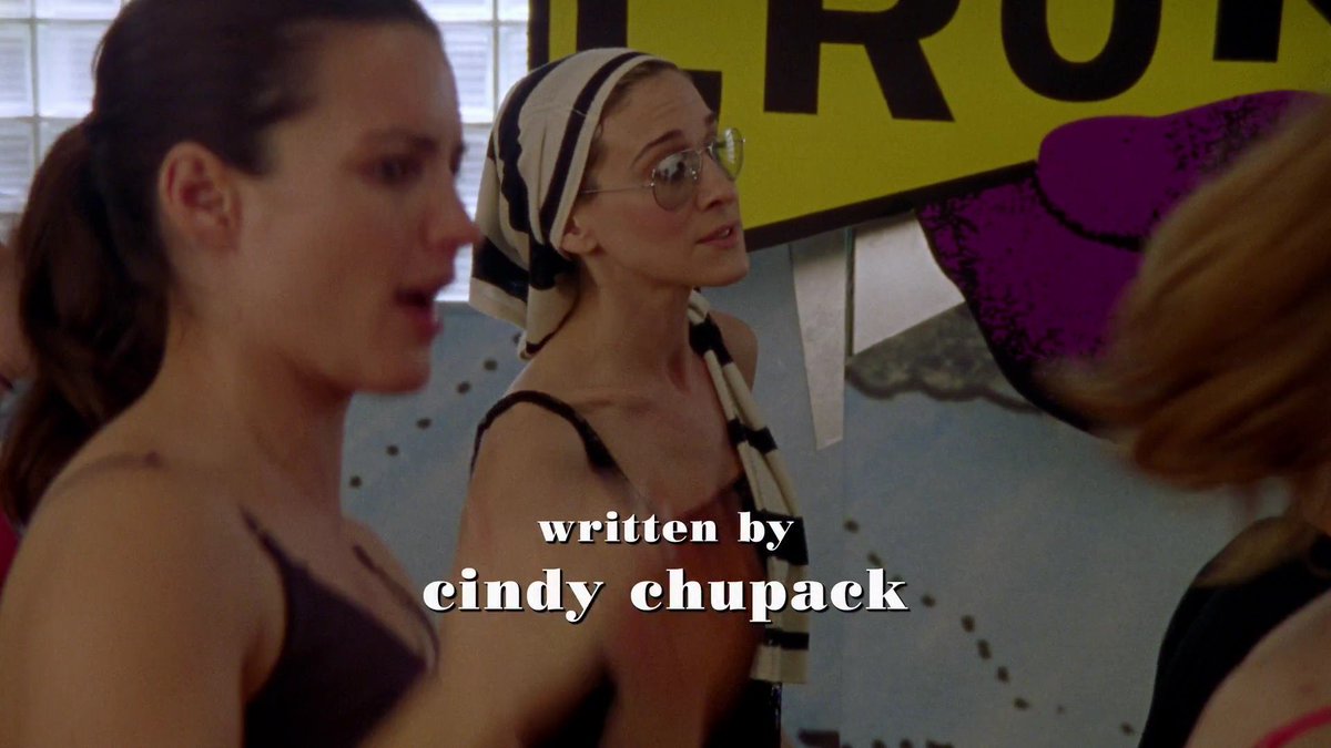 dumbandfunn's tweet photo. Carrie Bradshaw using a S/S 2001 Prada top as a hair wrap while she and Charlotte take an African dance class https://t.co/SyKGUQTFmP