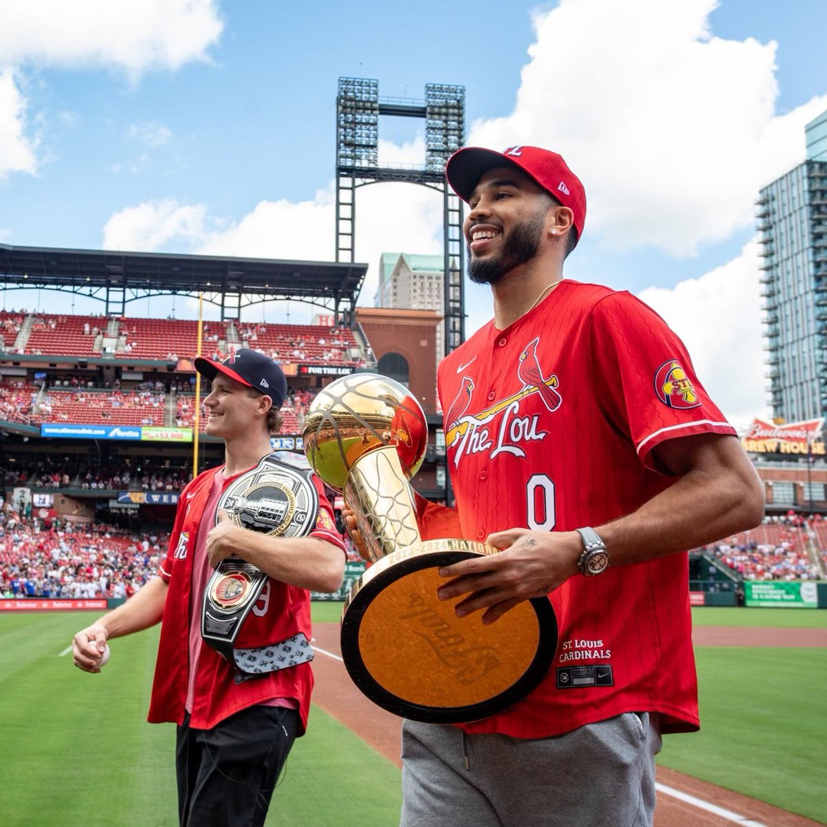 Cardinals's tweet photo. The champs are here! 🏆 

STL's own Jayson Tatum and Matthew Tkachuk bringing the hardware back to The Lou today!

#ForTheLou https://t.co/BvKnaMQSrp