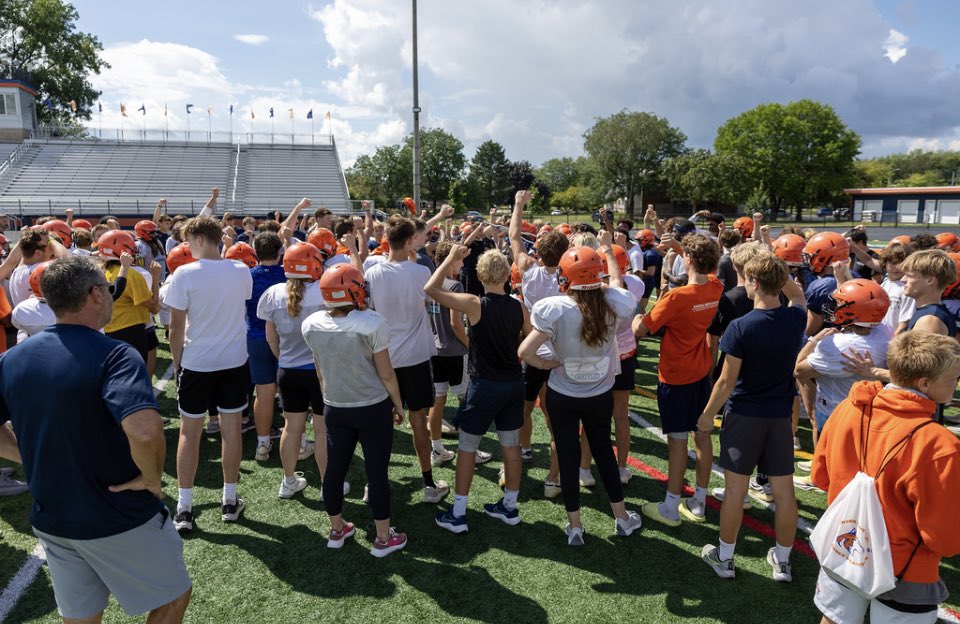 HuskieFB's tweet photo. To finish out Huskie Football Day of Greatness we had a moms/sons practice.  We had over 75 moms practice at their sons position and learn plays while wearing their helmet and shoulder.  We are very lucky to have so many parents involved in our program. Very thankful to the moms https://t.co/tVsujAI5L0