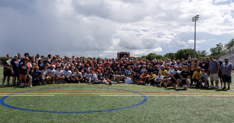 HuskieFB's tweet photo. To finish out Huskie Football Day of Greatness we had a moms/sons practice.  We had over 75 moms practice at their sons position and learn plays while wearing their helmet and shoulder.  We are very lucky to have so many parents involved in our program. Very thankful to the moms https://t.co/tVsujAI5L0