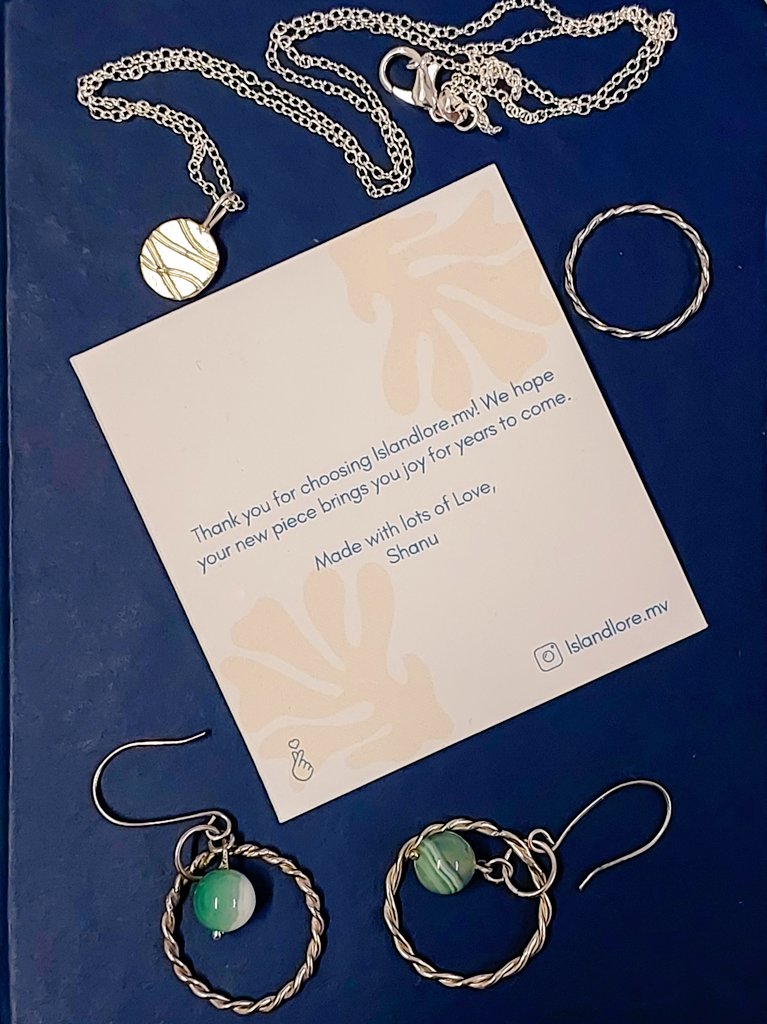 thundho's tweet photo. Lilly decided to model some earrings  (the magic of Fuvamulah) and a beautiful sea glass ring, while I bought some jewelry for myself. These were hand made by an amazing MALDIVIAN lady. Her page on Instagram is  "Islandlore . mv" Do check out her work. https://t.co/2z1jeySqas