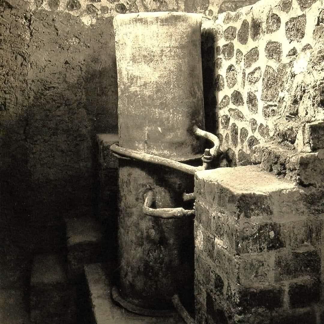 histories_arch's tweet photo. The world's only known intact Roman boiler, complete with all its pipes, valves, and accessories... 

It was unearthed during the excavations of the Villa della Pisanella in Boscoreale. This villa, nestled in the Roman countryside of Boscoreale near Naples, represents one of the many productive estates that dotted the northern suburbs of Pompeii during Roman era. Unfortunately, these sites have rarely been subjected to systematic excavation, with most only partially explored in hurried attempts to recover valuable artifacts. Consequently, many of these treasures are now dispersed across various museums worldwide.

The first evidence of the Villa della Pisanella emerged in November 1868, when Modestino Pulzella discovered remnants of ancient wall structures while laying the foundations for a new wall. Further excavations revealed mosaics, but the work was halted due to concerns raised by a neighboring landowner, Vincenzo De Prisco, about potential damage to his property. Excavations resumed in September 1894, driven by De Prisco himself, who had evidently overcome his earlier concerns. This phase of excavation unearthed the renowned "Boscoreale Treasure," which, due to inadequate cultural heritage laws, was unfortunately sold abroad.

After another brief hiatus, the excavation recommenced in May 1896, leading to the remarkable discovery of the Roman baths and the intact boiler, complete with its network of pipes. De Prisco subsequently restored part of the villa, converting it into a museum, known as the "Museo De Prisco." It was during this period that the Alinari Brothers captured an extraordinary photograph of the site.

The boiler itself was equipped with functional taps to regulate water flow, with valves designed to operate via a 90-degree rotation mechanism. These mechanisms were produced by the Collegia Fabrorum, adhering to precise standards, much like those defined by modern regulations, as documented by Frontinus in "De aquae ductu urbis Romae."

Constructed from lead, with bronze valves cast in a single mold, the boiler and its components were expertly assembled. The valves were connected to lead pipes using soldering techniques that involved heating small flat-tipped rods in portable forges. A 70% lead alloy solder wire was used, likely with pine resin as the flux, which helped distribute the solder evenly while preventing oxidation.

Today, the boiler is housed in the technological section of the National Archaeological Museum of Naples (MANN), though this section is currently undergoing renovation and is not open to the public. This remarkable piece of Roman engineering remains a testament to the ingenuity of ancient craftsmanship.

📷© Alinari Brothers

#archaeohistories