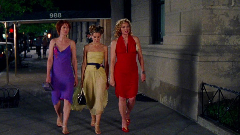 Carrie Bradshaw wearing a 1997 Chanel dress to Charlotte and Trey's  engagement party