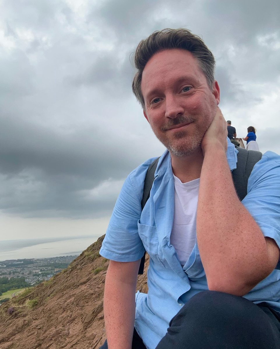 TomWicker's tweet image. On Arthur’s Seat for the first time since my first anniversary of coming out, in August 2000. I was with cast-mates. We were on the cusp of everything. Or is that just how I remember it? A friend from that play has since died. I hadn’t expected to be emotional. But here we are.