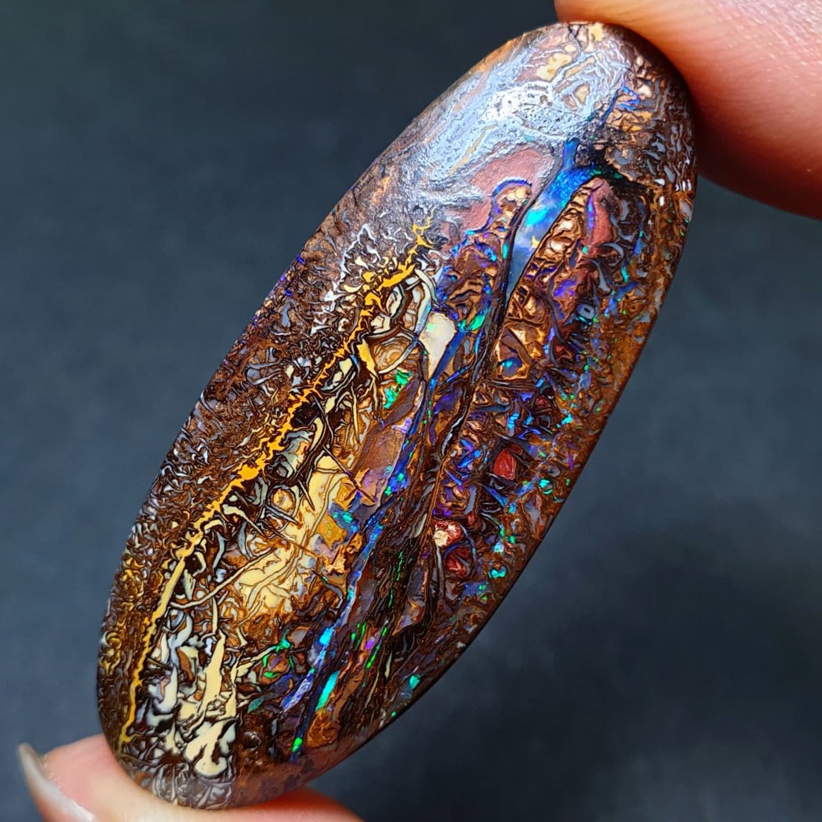 A mesmerizing double-sided Koroit boulder opal, showcasing intricate patterns in vibrant colors.

Photo: Wild Opals