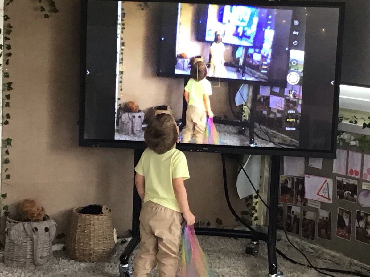 PenileeNursery's tweet photo. We connected the iPad to the touch screen. We were all so excited to see ourselves on the big screen. We all took turns of sharing the iPad and using it to walk around the nursery to see it from their perspective. #littlelearnersofpenill #digitallearners https://t.co/FeSMv4fz4e