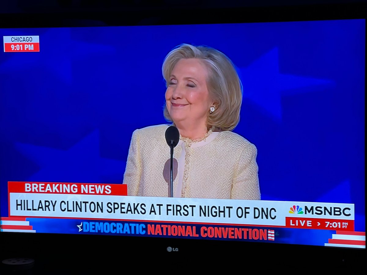 SarahBurris's tweet photo. Hillary Clinton’s smile when the crowd goes off on a “Lock him up” chant https://t.co/dZ3aUIzGLB
