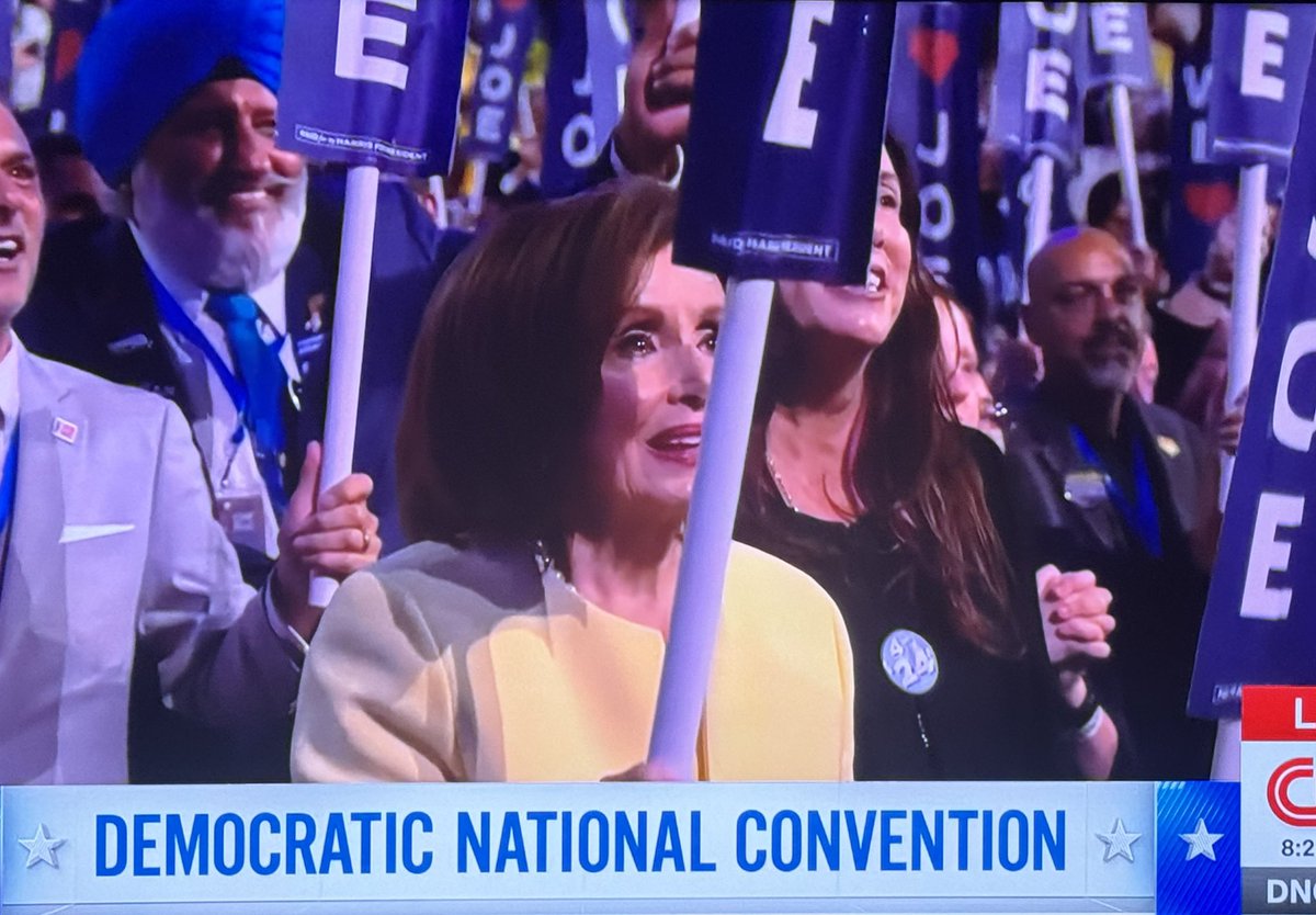 igorbobic's tweet photo. Pelosi holding up a We Love Joe sign https://t.co/ECB0A6SNWu