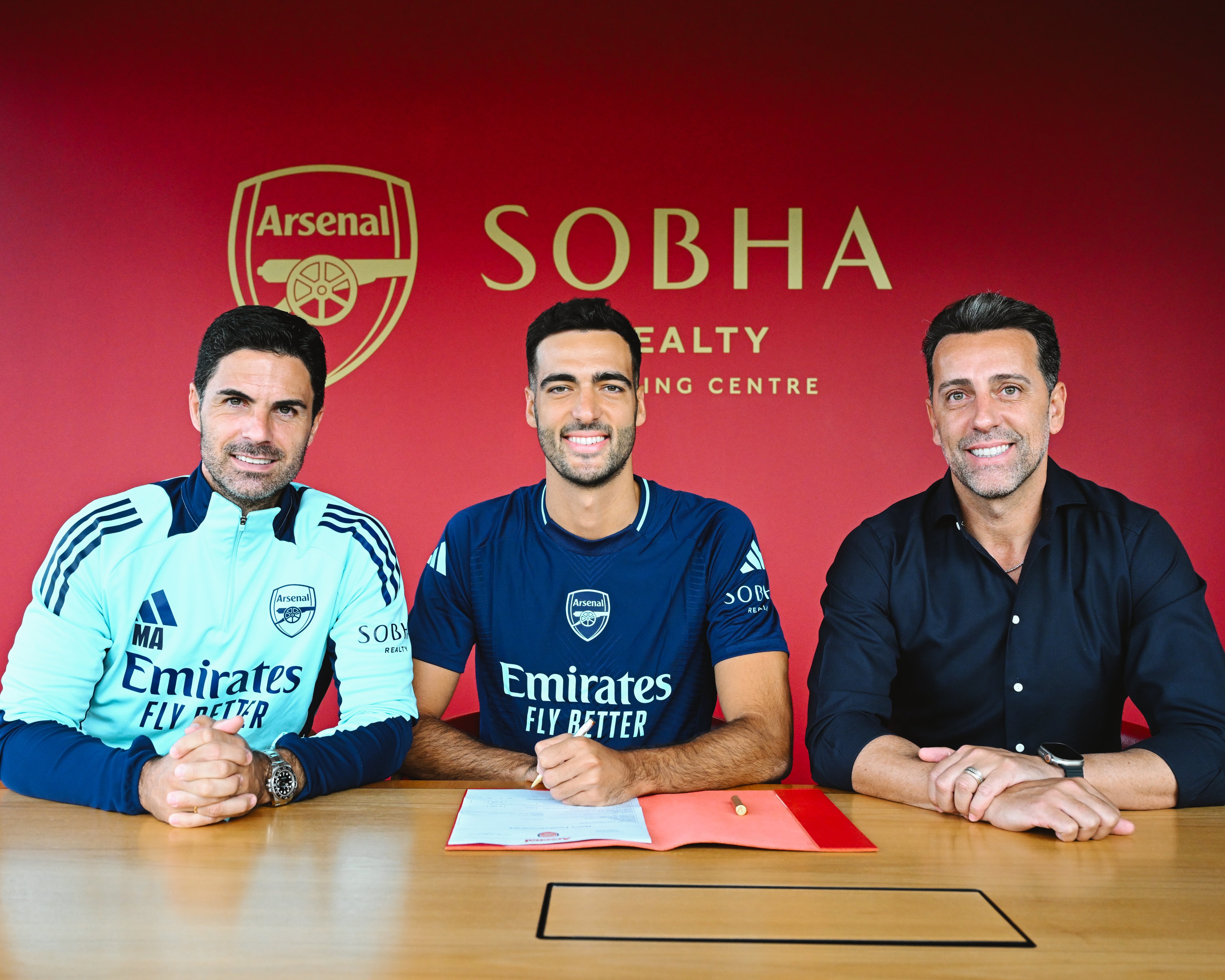 Mikel Merino signing his contract at Arsenal alongside Edu and Mikel Arteta 