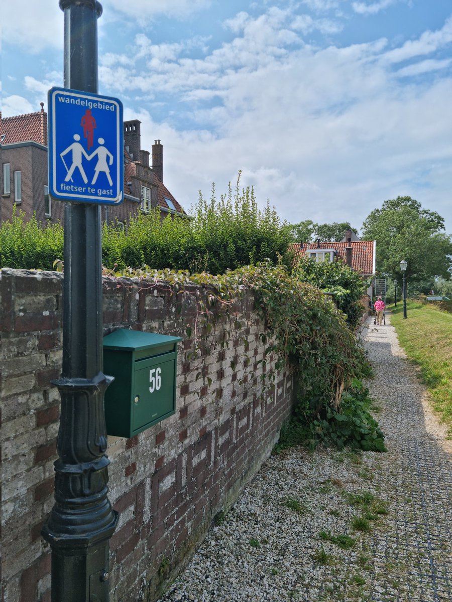 Bikes are guests. Pedestrian priority path.