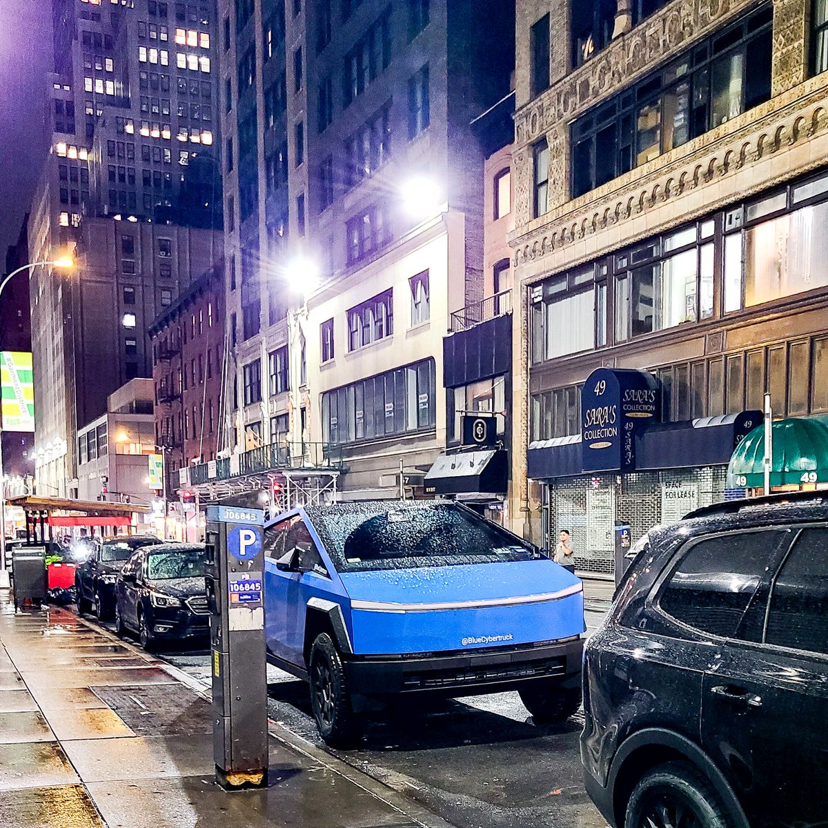 BlueCybertruck's tweet photo. The #bluecybertruck rolling through NYC like a fridge on wheels—because even dumpsters deserve a night out in the city! 🚛💙 #UrbanAdventures #CityLife #NYC #bluecybertruck #cybertruck #tesla https://t.co/d97wnmwx0t