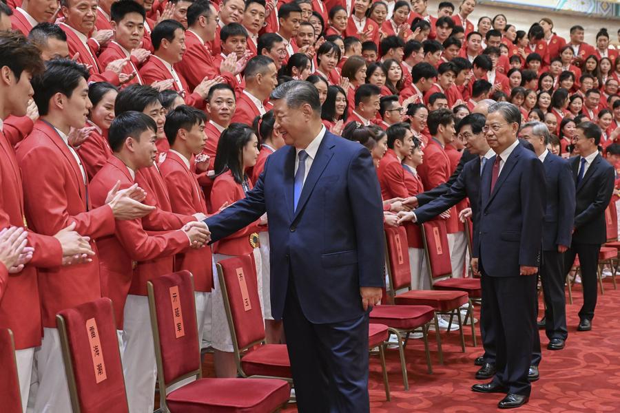 Meeting China's Olympic delegation for Paris 2024 at the Great Hall of the People, President Xi Jinping urged the Olympians to make further efforts to build China into a sports powerhouse. xhtxs.cn/WgF
